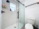 Updated bathroom features a glass-enclosed shower and modern fixtures at 4316 Natchez Trace Dr, St Cloud, FL 34769