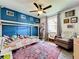 Comfortable bedroom featuring stylish decor, a ceiling fan, and plenty of natural light at 4316 Natchez Trace Dr, St Cloud, FL 34769