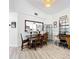Dining area with natural light, seating for six, and a view into the updated kitchen at 4316 Natchez Trace Dr, St Cloud, FL 34769