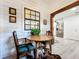 Dining area with a view of the updated kitchen and hardwood-style floors at 4316 Natchez Trace Dr, St Cloud, FL 34769