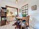 Cozy dining nook with shiplap walls, rustic furniture, and a view to the main room at 4316 Natchez Trace Dr, St Cloud, FL 34769