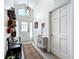 Bright entryway featuring a pendant light, decorative rug, a bench and neutral-colored walls at 4316 Natchez Trace Dr, St Cloud, FL 34769