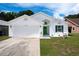 Charming single-story home with a well-manicured lawn, two-car garage, and beautiful landscaping at 4316 Natchez Trace Dr, St Cloud, FL 34769