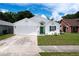 Charming single-story home featuring a well-maintained lawn, two-car garage, and bright green front door at 4316 Natchez Trace Dr, St Cloud, FL 34769