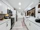Modern kitchen featuring sleek countertops, stainless steel appliances, and ample cabinet space for storage at 4316 Natchez Trace Dr, St Cloud, FL 34769