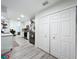 Bright kitchen featuring white cabinetry, stainless steel appliances, and a view to the dining area at 4316 Natchez Trace Dr, St Cloud, FL 34769