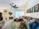 Open living room showcasing a large sectional sofa, area rug, and tent in the background at 4316 Natchez Trace Dr, St Cloud, FL 34769