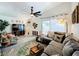 Inviting living room with stylish decor, comfortable seating, and access to outdoor patio via glass sliding doors at 4316 Natchez Trace Dr, St Cloud, FL 34769