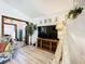 Bright living room with decorative furnishings, hardwood floors, and backyard views at 4316 Natchez Trace Dr, St Cloud, FL 34769