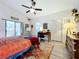 Spacious main bedroom with a private patio, desk, and ample closet space at 4316 Natchez Trace Dr, St Cloud, FL 34769