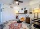 Well-lit office with built-in storage, modern furnishings, and plush rug at 4316 Natchez Trace Dr, St Cloud, FL 34769