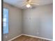 This bedroom features wood-look floors and a ceiling fan with light at 3224 Dante Dr # 108, Orlando, FL 32835