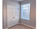 Bedroom featuring closet, window and wood-look floors at 3224 Dante Dr # 108, Orlando, FL 32835