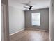 Bedroom with neutral walls, ceiling fan, modern flooring and a window for natural light at 3224 Dante Dr # 108, Orlando, FL 32835