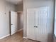 Hallway view showing access to closet and additional room at 3224 Dante Dr # 108, Orlando, FL 32835