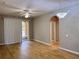 Living room featuring gray paint, wood floors, a sliding door to the patio, and a modern chandelier at 3224 Dante Dr # 108, Orlando, FL 32835