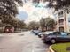 Well-maintained parking area in a residential community, surrounded by lush trees and landscaping at 3224 Dante Dr # 108, Orlando, FL 32835