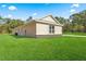 A sprawling green lawn surrounds the back of this single-story home with stone accents at 13455 Sw 85 Pl, Dunnellon, FL 34432