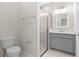 Fresh bathroom with modern vanity, a shower with glass doors, a matching toilet, and tile floors at 13455 Sw 85 Pl, Dunnellon, FL 34432