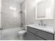 A full bathroom with a shower-tub combo, granite vanity, and matching toilet at 13455 Sw 85 Pl, Dunnellon, FL 34432