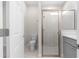 Modern bathroom with shower, toilet and gray vanity at 13455 Sw 85 Pl, Dunnellon, FL 34432