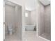 Bathroom with a stand alone tub, shower and private toilet at 13455 Sw 85 Pl, Dunnellon, FL 34432