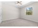 Bedroom with ceiling fan and window at 13455 Sw 85 Pl, Dunnellon, FL 34432