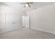 Bedroom with gray carpet and double door closet at 13455 Sw 85 Pl, Dunnellon, FL 34432