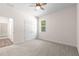 Cozy bedroom with plush carpeting, a ceiling fan and a closet at 13455 Sw 85 Pl, Dunnellon, FL 34432