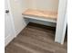 Mudroom bench with wood top for storage and seating near entryway at 13455 Sw 85 Pl, Dunnellon, FL 34432