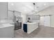 Modern kitchen with gray cabinets, stainless steel appliances, and an island with contrasting blue base at 13455 Sw 85 Pl, Dunnellon, FL 34432