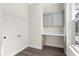 Functional laundry room with cabinetry, a folding counter, and a rack for hanging clothes at 13455 Sw 85 Pl, Dunnellon, FL 34432