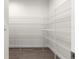 Walk-in pantry with wire shelving for organized storage and wood-look floors at 13455 Sw 85 Pl, Dunnellon, FL 34432