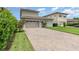 Charming home with a two-car garage and a meticulously paved driveway at 10266 Beechwood Ln, Orlando, FL 32832