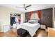 Bedroom featuring hardwood floors and a spacious closet at 2495 Sedgefield Ave, Deltona, FL 32725
