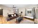 Bright and airy living room with wood floors and large windows at 2495 Sedgefield Ave, Deltona, FL 32725