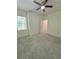 Bright bedroom with ceiling fan and walk-in closet at 9825 Red Eagle Dr, Orlando, FL 32825
