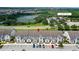 Aerial view showing townhouses, parking, and nearby amenities at 154 Captiva Dr, Davenport, FL 33896