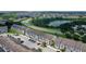 Aerial view of townhouses near a lake and road at 154 Captiva Dr, Davenport, FL 33896