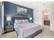 Bright Primary bedroom with king-size bed and ensuite bathroom access at 154 Captiva Dr, Davenport, FL 33896