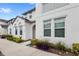 Front view of townhouse with landscaping and walkway at 154 Captiva Dr, Davenport, FL 33896