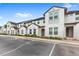 Front view of townhouses with parking and landscaping at 154 Captiva Dr, Davenport, FL 33896