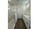 Modern bathroom featuring a glass shower, white cabinets, and double sinks at 29 W 17Th St, Apopka, FL 32703