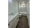 Bathroom featuring white vanity, granite countertop, and tiled shower at 29 W 17Th St, Apopka, FL 32703