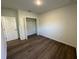 This bedroom features a closet, wood floors, and neutral walls at 29 W 17Th St, Apopka, FL 32703