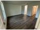 Bright bedroom with wood-look floors, ensuite bathroom and closet at 29 W 17Th St, Apopka, FL 32703