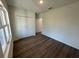 Bedroom with wood-look flooring and closet at 29 W 17Th St, Apopka, FL 32703