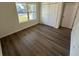 Bedroom with wood-look flooring and closet at 29 W 17Th St, Apopka, FL 32703