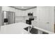 Modern kitchen featuring stainless steel appliances and white cabinets at 29 W 17Th St, Apopka, FL 32703