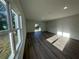 Bright, airy living room with wood-look flooring and neutral walls at 29 W 17Th St, Apopka, FL 32703